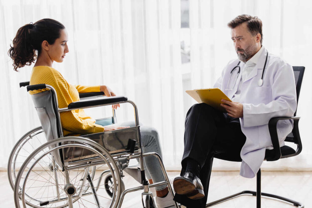 handicap women is sitting in front of the doctor